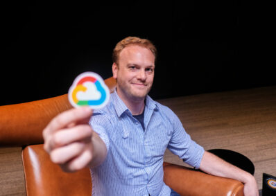 consultant proudly holding up Google sticker